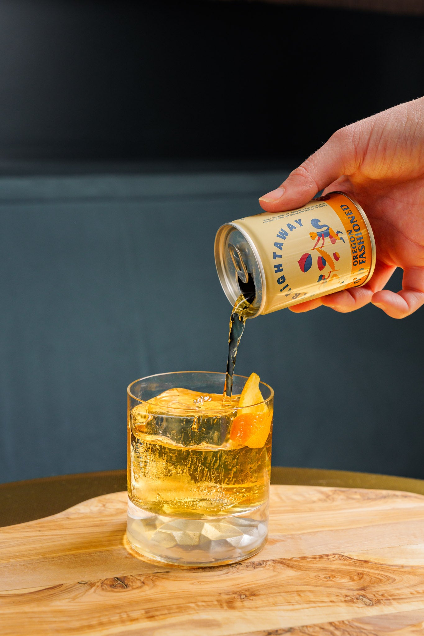 Pour photo of our 100ml Oregon Old Fashioned into a rocks glass. 